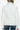 Back view of women's white faux leather puffer jacket with structured design.
