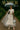 Pointelle knit set with silver accessories, sheer gloves, and tulle cape in garden setting