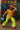 Model in oversized striped shirt with neon green pants, pink platforms, and teal bag