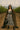 Gingham dress styled with sheer black cape and combat boots in vineyard