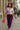 Checker contrast top styled with purple trousers, pink heels and mini bag for Parisian vibe