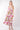 Model wearing vibrant Tropical Cami Midi Dress
