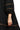 Black dress with gold trim on a white background