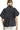 Back view showing loose silhouette and collar shape.