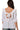 Back view of square neck babydoll blouse with ruffle trim and half length puff sleeves in white