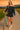 Woman walking with a bicycle on a path during sunset