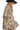 Side view of oak mini dress highlighting sleeve volume and flowy silhouette