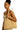 Model wearing ivory braided straw tote bag over shoulder with natural, oversized shape