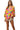Model in bubble pop top with solid short for a playful streetwear outfit