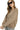 Woman wearing a beige sweatshirt with a textured pattern on a white background