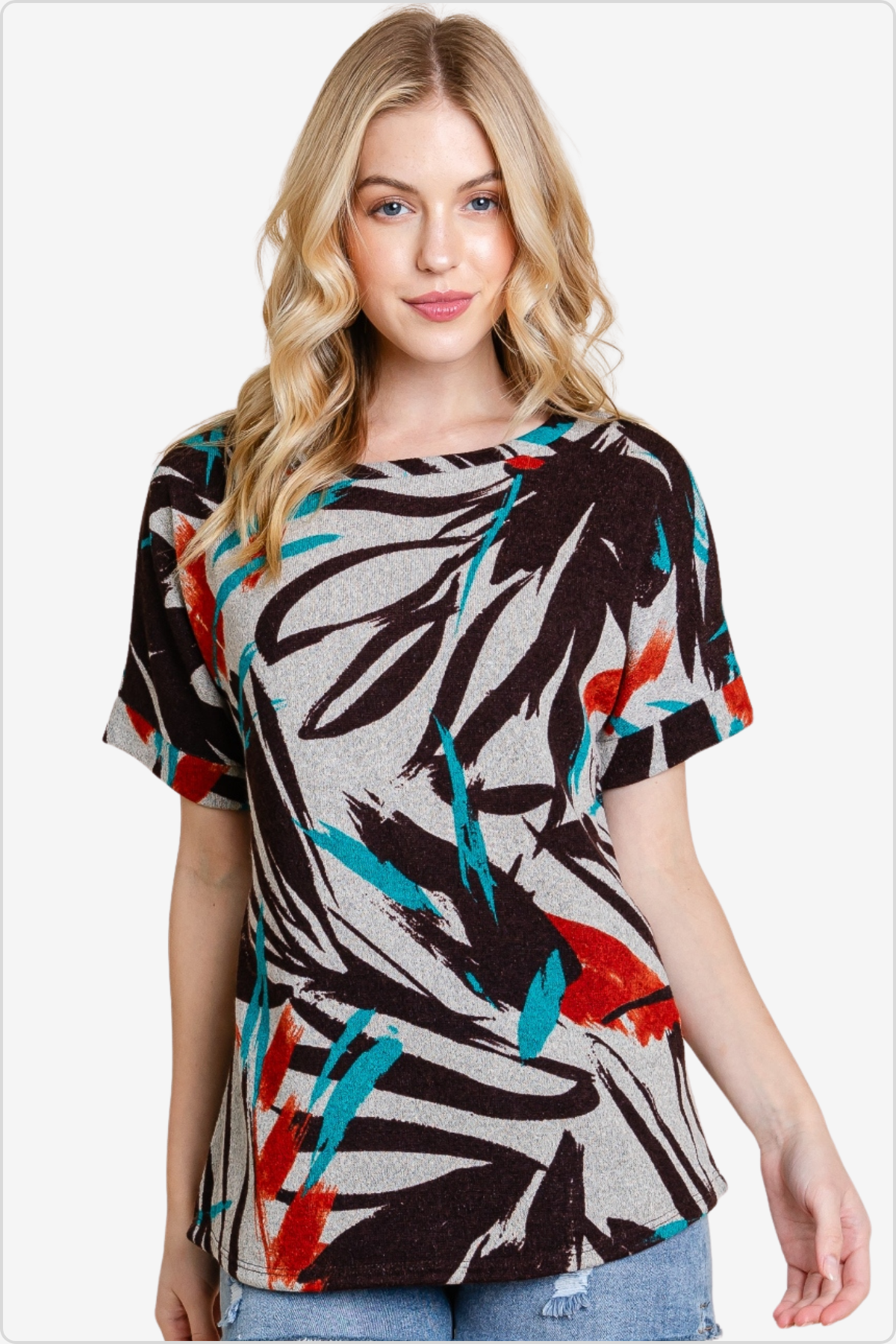 Woman in a trendy abstract print t-shirt in cool tones, fashion-forward casual wear.
