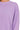 Close-up of ribbed neckline and pigment-dye fabric detail.