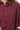 Close-up view of cotton linen fabric and scallop hem detail on merlot colorblock shirt.