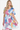 Woman in a dress with bold geometric shapes, radiating contemporary elegance, Color Multicolor