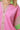 Close-up of pink and green contrast trim detailing on collar and sleeves