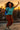Dancing on rooftop in cotton gauze shirt with cargo pants and silver boots, urban sunset view