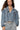Front view of dusty blue denim jacket with multiple zippers and dropped shoulders