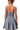 Back view of blue denim dress with clean seams and flared skirt