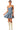 Model front view in A-line denim mini dress with pleats and fitted waist