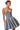 Side view of denim mini dress showing flared skirt and tailored fit