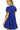 Back view of dark blue mini dress showing tiered skirt and flowing fit