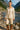 Woman standing by mountain river in Fitted Linen Blend Shirt with Ribbon Embroidery Color: OATMEAL, daylight.