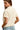 Back view of oatmeal knit sweater with clean finish and loose shape