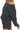 Side view of black fleece set showing oversized top and casual shorts