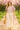 Walking in floral puff sleeve blouse with wide-leg trousers and platform sandals, cherry blossom path, golden light