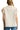 Back view of cream blouse with clean lines and subtle frill hem