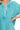 Close-up of light teal gauze texture with button placket and split neck