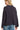 Back view of midnight openwork cardigan with eyelet knit and straight hem