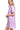 Side view of a lavender acid wash denim shirt dress with a raw hem and front pocket detail