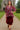 Model strolling in Mix Paisley Boho Tunic Blouse Color: Wine Mix with velvet bloomers, castle pathway.