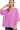 Model wearing oversized ribbed tee in mauve with quarter sleeves and straight hem.