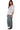 Side view of a model wearing a square neck babydoll blouse with puff sleeves and floral embroidery