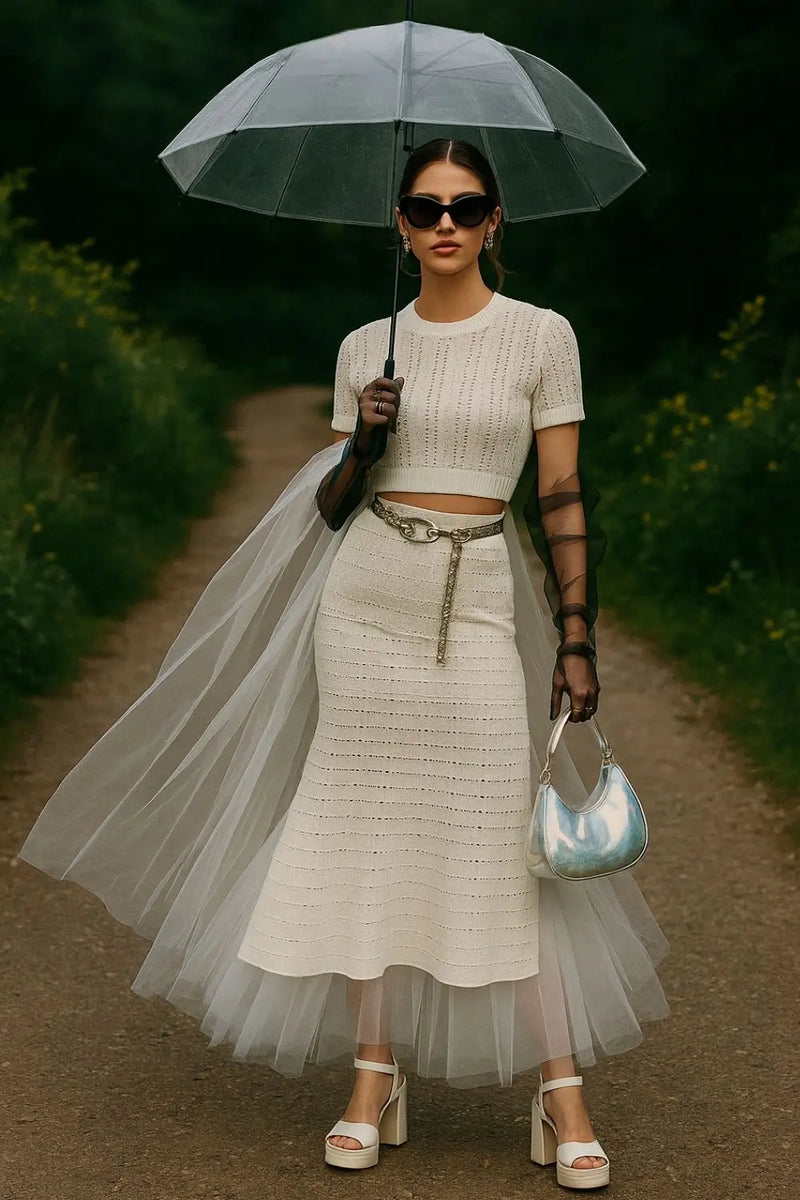 Pointelle knit set with silver accessories, sheer gloves, and tulle cape in garden setting