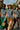 Denim jacket styled with green skirt, brown shorts and black pants for urban group look