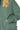 Close-up of dark forest scuba texture with visible stitching and fabric depth