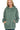 Woman wearing a green hoodie on a white background