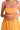 Closeup of velvet tape smocking on bodice of midi dress with slight stretch and no lining