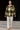 Woman standing in Plaid Fleece Shacket with beige loafers, on concrete steps, modern building backdrop