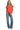 Model wearing coral red polo sweatshirt with short sleeves and cropped shape