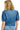 Back view of a person wearing a blue denim shirt on a white background