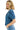 Woman wearing a blue denim jacket and jeans on a white background