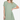Woman in a sage green ribbed dress, embodying a relaxed yet chic aesthetic.