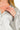 Close-up of silver satin fabric showing soft luster and lapel detail