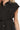 Close-up of black shirt fabric and buttons