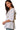 Side view of a white square neck babydoll blouse with puff sleeves and floral embroidery