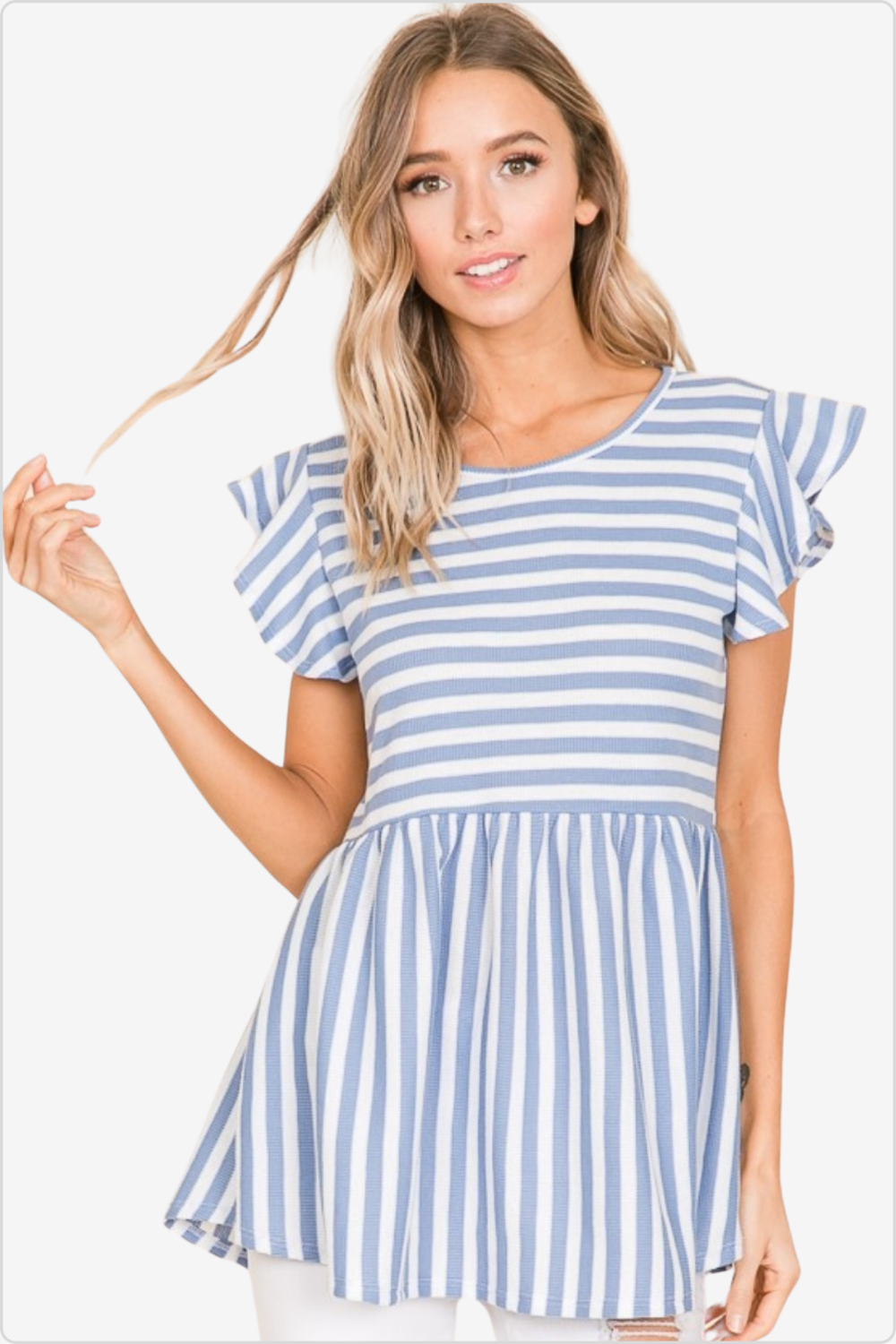 Woman in blue striped flutter sleeve top and white jeans for a fresh summer look.